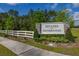 Estates at Southern Pines entrance sign with manicured landscaping and white picket fence at 236 Pink Ibis Bnd, St Cloud, FL 34772