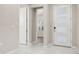 Clean entryway with tile flooring and a view into another room, showcasing the home's open layout at 236 Pink Ibis Bnd, St Cloud, FL 34772