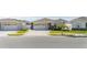 Attractive one-story house featuring a two-car garage, stone details, and meticulously maintained landscaping at 236 Pink Ibis Bnd, St Cloud, FL 34772