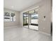 Bright flex room with sliding doors to the backyard area and tile flooring at 236 Pink Ibis Bnd, St Cloud, FL 34772
