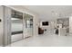 Bright flex room with sliding doors to the backyard area and tile flooring, open layout to the kitchen at 236 Pink Ibis Bnd, St Cloud, FL 34772