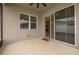 An indoor/outdoor lanai with sliding glass doors and white vinyl fencing at 236 Pink Ibis Bnd, St Cloud, FL 34772