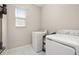 Laundry room with a modern washer and dryer at 236 Pink Ibis Bnd, St Cloud, FL 34772