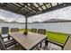 Covered patio with an outdoor dining table, overhead lighting, and ample space for entertaining guests at 236 Pink Ibis Bnd, St Cloud, FL 34772