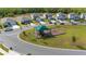 Aerial view of community playground with swings and covered play structure at 236 Pink Ibis Bnd, St Cloud, FL 34772