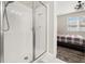 Bathroom featuring double sinks, granite countertops, and a glass door shower at 236 Pink Ibis Bnd, St Cloud, FL 34772