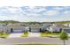 Neighborhood street showcasing well-kept homes with manicured lawns, enhancing community charm at 236 Pink Ibis Bnd, St Cloud, FL 34772