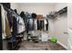 This walk-in closet has hardwood floors, hanging racks, and shelving at 236 Pink Ibis Bnd, St Cloud, FL 34772