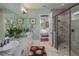 Bright bathroom with double sinks, granite countertops, and glass-enclosed shower at 2454 Dream Home Ct, St Cloud, FL 34772