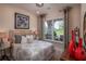 Cozy bedroom with natural light from the window and stylish decor at 2454 Dream Home Ct, St Cloud, FL 34772