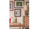 The hallway boasts decorative prints, a lamp, cabinet, and bench creating an inviting and stylish space at 2454 Dream Home Ct, St Cloud, FL 34772