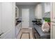 Well-organized laundry room with modern appliances and ample cabinet space at 2454 Dream Home Ct, St Cloud, FL 34772