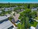 An aerial view displays mature landscaping, home with fenced-in backyard, and a glimpse of a cozy patio at 2817 Prince John Rd, Winter Park, FL 32792