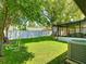 Spacious backyard featuring lush lawn and shade trees at 2817 Prince John Rd, Winter Park, FL 32792