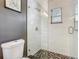 Modern bathroom features a glass shower door and decorative mosaic tiled shower floor at 2817 Prince John Rd, Winter Park, FL 32792
