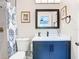 Bathroom showcasing a stylish vanity with a modern sink and mirror, complimented by a framed print at 2817 Prince John Rd, Winter Park, FL 32792