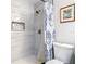 Bright bathroom featuring a modern shower with a tiled surround and decorative niche at 2817 Prince John Rd, Winter Park, FL 32792