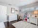 Spacious bedroom with hardwood floors and large windows at 2817 Prince John Rd, Winter Park, FL 32792