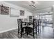 Elegant dining room with modern chandelier and wine rack, perfect for hosting dinner parties at 2817 Prince John Rd, Winter Park, FL 32792