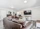 Bright living room featuring cozy seating and open space for entertaining at 2817 Prince John Rd, Winter Park, FL 32792