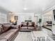 Open-concept living room with comfortable seating and abundant natural light at 2817 Prince John Rd, Winter Park, FL 32792