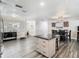 Spacious living room with updated lighting fixtures and access to a dining area and kitchen at 2817 Prince John Rd, Winter Park, FL 32792