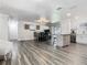 Spacious living area with a dining room, kitchen, and stylish decor, creating a welcoming atmosphere at 2817 Prince John Rd, Winter Park, FL 32792