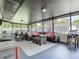 Expansive screened-in patio with comfortable seating and dining areas, ideal for entertaining guests at 2817 Prince John Rd, Winter Park, FL 32792
