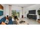 Bright living room with a sliding glass door, stylish decor, and modern furniture at 3082 Skyline Loop, Kissimmee, FL 34758