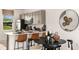 Modern kitchen with stainless steel appliances, light gray cabinets and a breakfast bar at 3090 Skyline Loop, Kissimmee, FL 34758