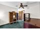 Bright room with built-in storage and a ceiling fan at 3218 Cimarron Dr, Orlando, FL 32829