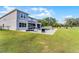 Expansive backyard with a pool, lush green lawn, and outdoor entertainment area at 3417 Michigan St, Lake Mary, FL 32746