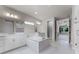 Bright bathroom with soaking tub, walk-in shower, and dual vanities for a luxurious spa-like retreat at 3417 Michigan St, Lake Mary, FL 32746