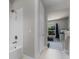 Bathroom featuring white tile shower and view into the bedroom at 3417 Michigan St, Lake Mary, FL 32746