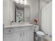 Bright bathroom featuring a white vanity with a quartz countertop and a large mirror at 3417 Michigan St, Lake Mary, FL 32746