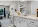 Bathroom with a white vanity, quartz countertop, and view into the bedroom at 3417 Michigan St, Lake Mary, FL 32746