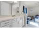 Bathroom with a white vanity, quartz countertop, and view into the bedroom at 3417 Michigan St, Lake Mary, FL 32746