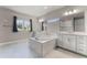 Luxurious bathroom featuring dual vanities, a soaking tub, and modern fixtures for a spa-like experience at 3417 Michigan St, Lake Mary, FL 32746