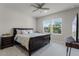 Comfortable bedroom with a ceiling fan, large windows, and neutral decor for a restful retreat at 3417 Michigan St, Lake Mary, FL 32746
