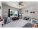 Spacious bedroom with large windows, toys and a ceiling fan at 3417 Michigan St, Lake Mary, FL 32746