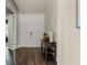 Welcoming entryway with dark wood floors, a console table, and a view into the adjacent rooms at 3417 Michigan St, Lake Mary, FL 32746