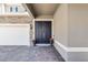 Inviting front entrance with a double door, brick paved porch, and attractive exterior lighting at 3417 Michigan St, Lake Mary, FL 32746
