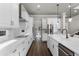 Modern kitchen featuring white countertops and cabinetry, stainless steel appliances, and hardwood floors at 3417 Michigan St, Lake Mary, FL 32746