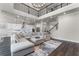 Bright living room with soaring ceilings, modern chandelier, and an open floor plan at 3417 Michigan St, Lake Mary, FL 32746