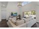Open living room with high ceilings, a large sectional sofa, and access to the pool area at 3417 Michigan St, Lake Mary, FL 32746