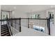 Bright loft space with wrought iron railings overlooking the living room, perfect for flexible living at 3417 Michigan St, Lake Mary, FL 32746