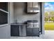 Built-in outdoor kitchen boasts stainless steel appliances and granite countertops at 3417 Michigan St, Lake Mary, FL 32746