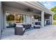 Covered outdoor patio with a ceiling fan, fireplace, television, and outdoor furniture at 3417 Michigan St, Lake Mary, FL 32746