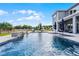 Relax by the pool with a stone waterfall feature in this beautiful backyard at 3417 Michigan St, Lake Mary, FL 32746