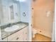 Stylish bathroom features a granite vanity, modern fixtures, and a walk-in shower for a sleek and functional design at 3461 Home Town Ln, St Cloud, FL 34769